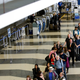 90-minute waits at O’Hare yesterday. AP Photo/Teresa Crawford